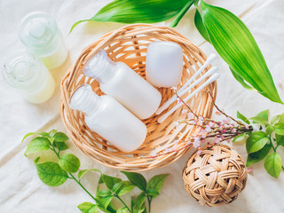 Bathroom accessories. Shower gel, body lotion, shampoo on fabric background for the bath.