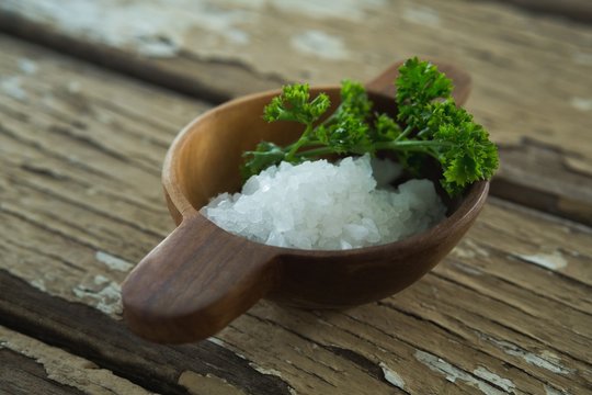 Salt and coriander leaves in bowl