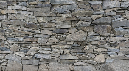 Old stone wall in village