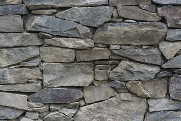 Old stone wall in village