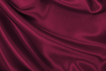 Smooth elegant pink silk or satin luxury cloth texture as abstract background. Luxurious valentines day background design