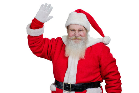 Santa Claus smiling and waving. Happy Santa Claus with real beard waving with hand on white background. Greeting of santa Claus, sstudio shot.