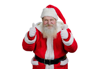 Portrait of Santa giving thumbs up gesture. Smiling Santa Claus giving thumb up gesture with both hands on white background. Studio shot of cheerful Santa with ok sign.