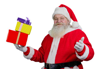 Portrait of Santa Claus with gift boxes. Santa Claus holding miulticolored boxes with gifts on white background. New Year and Christmas concept.