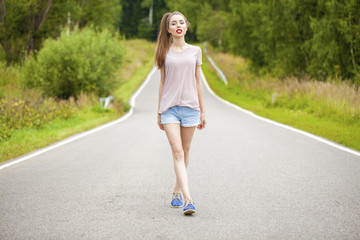Young beautiful brown haired woman in blue jeans