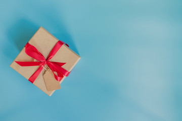 top view brown gift box for new year on blue pastel color background with space.