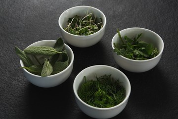 Various herbs in bowls