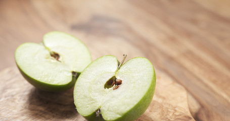 green apple on wood board