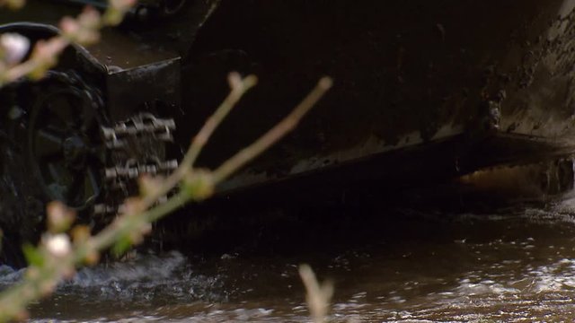 the tank rides through the water