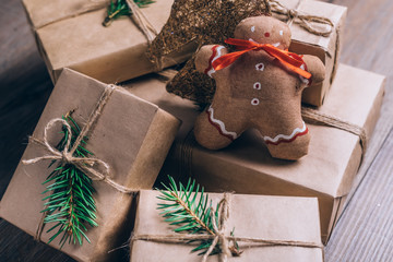 Christmas Gifts with Boxes on Wooden Background. Vintage Style. Closeup, selective focus.