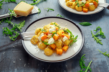 Homemade Butternut squash gnocchi with wild rocket and parmesan, ricotta cheese