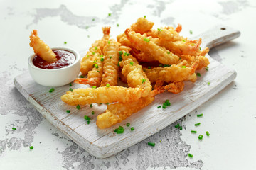 Fried Shrimps tempura with sweet chili sauce on white wooden board