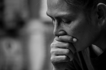 Sad Asian woman in black and white