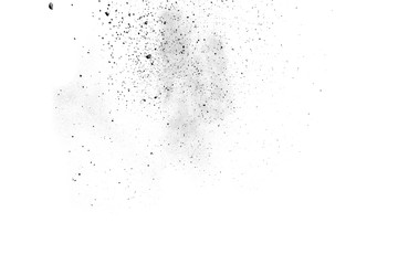 Black powder splatted on white background.