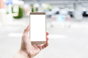 man use smartphone at carpark outdoor