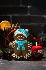 Christmas composition with mulled wine and gingerbread man, vertical