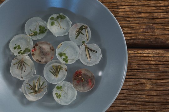 Flavored ice cubes with herb - Powered by Adobe