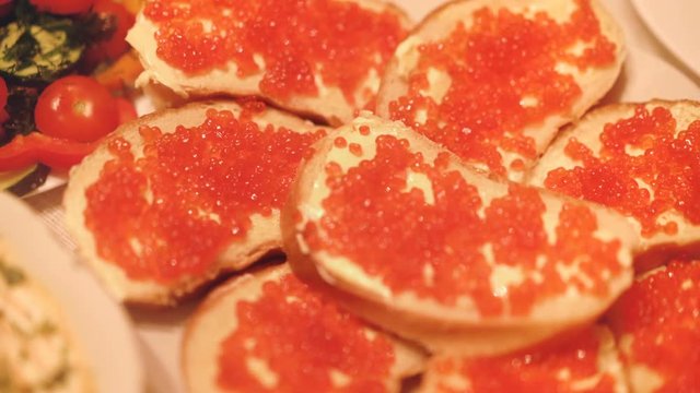 Sandwiches with butter and red caviar of salmon salmon fish species