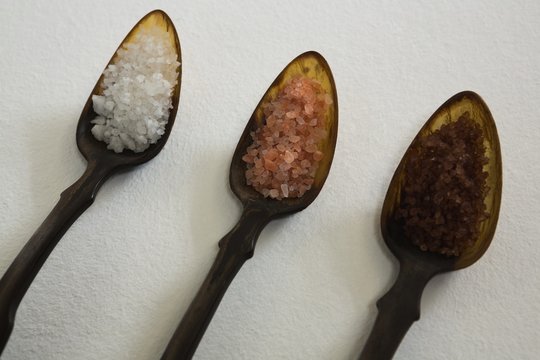 Various types of sea salt in a spoon