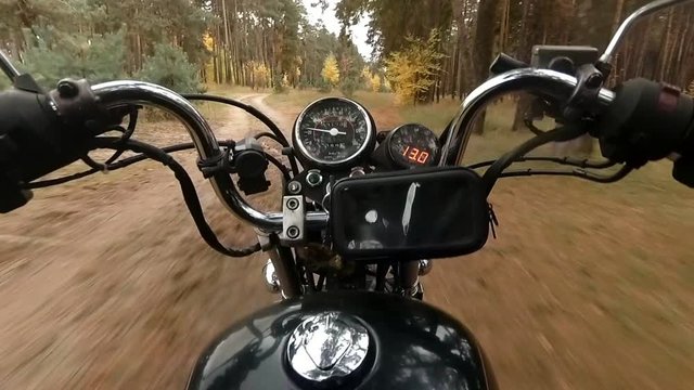 Motorcycle chopper puts on a forest road
