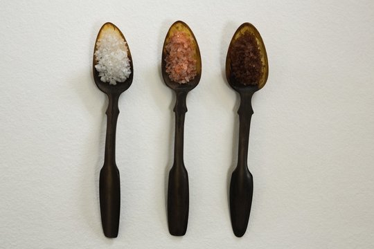 Various types of sea salt in a spoon