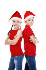 Children boy and girl with Santa hat on white background isolated