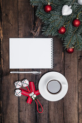 Christmas background with notebook on wood and xmas tree