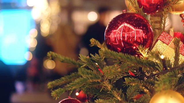 Decorated christmas tree branch with red balls