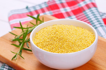 bowl of raw millet grains