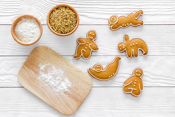 Make gluten free healthy food. Yoga asanas cookies near desk, flour and wheat on white background...