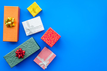 Cyber monday concept. Gift boxes pattern on blue background top view copyspace