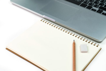 Business office work desk table with computer laptop , note and stationery on white table background include copyspace for add text or graphic