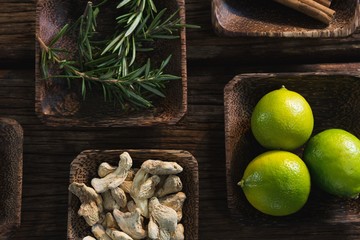 Dried ginger, lime and rosemary herb in a bowl
