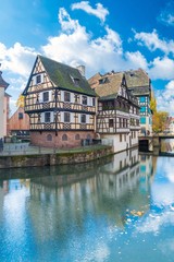 Fototapeta na wymiar Typical house near water from La Petite France in Strasbourg, Alsace, France