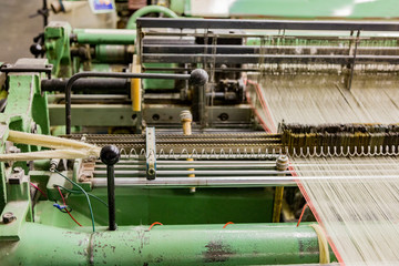 Part of the obsolete green loom at the weaving factory
