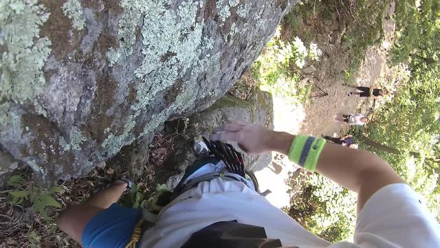  a younger man climbs to the rock,  rock climbing equipment, Free climbing, a clip from his perspective, 4k