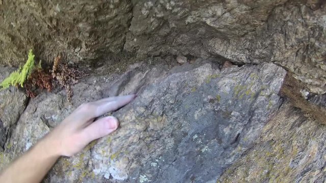  a younger man climbs to the rock,  rock climbing equipment, Free climbing, a clip from his perspective, 4k