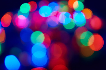 Blurred lights garland on a dark background