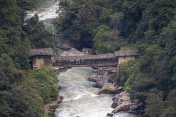 Cantilevered Bridge, Trongsa, Bhutan. This ancient bridge is hundreds of years old. © Betty Sederquist