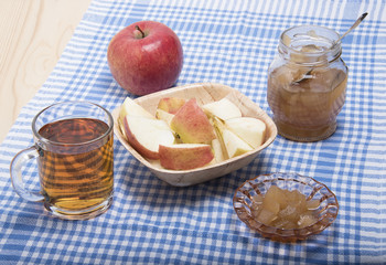 Slices of ripe apple, apple jam and apple juice