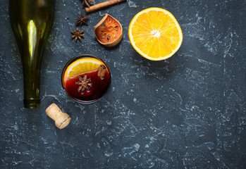 Mulled wine recipe ingredients on black chalkboard with text space