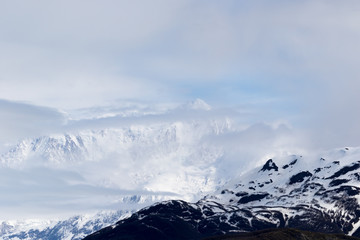 Fototapeta na wymiar mountain peaks in the clouds