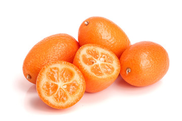 Cumquat or kumquat with half isolated on white background close up