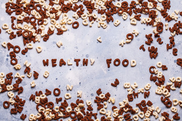 Dry breakfast, granola, muesli on a gray background, horizontal, top view, copyspace, flat lay