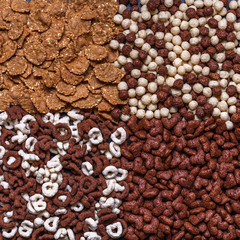 Dry breakfast, granola, muesli on a black background, square, top view, copyspace, flat lay
