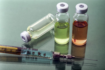  Several Vials And Syringe In Laboratory, Conceptual Image 