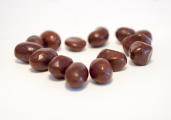 Peanuts in chocolate isolated on white background.