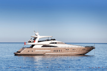 Fototapeta na wymiar Luxury white yacht sailing in Mediterranean azure sea