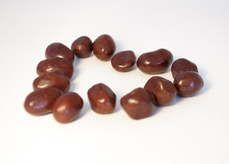 Peanuts in chocolate isolated on white background.