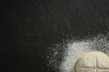 Cropped image of flour on unbaked bun